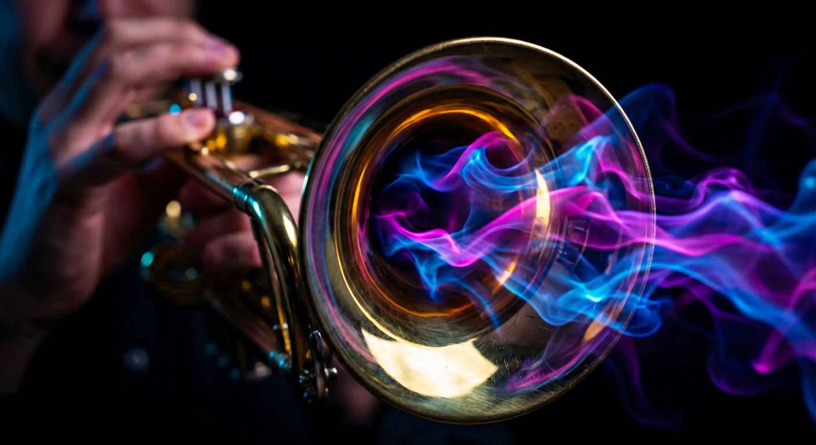 Close-up of a trumpet's brass bell with swirling Electric Blue, Pink, and Purple light energy mist flowing out of it, representing amplified marketing voice.