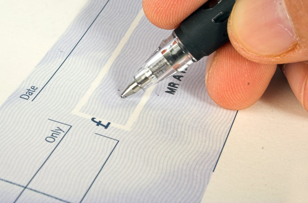 signing a cheque 2-1